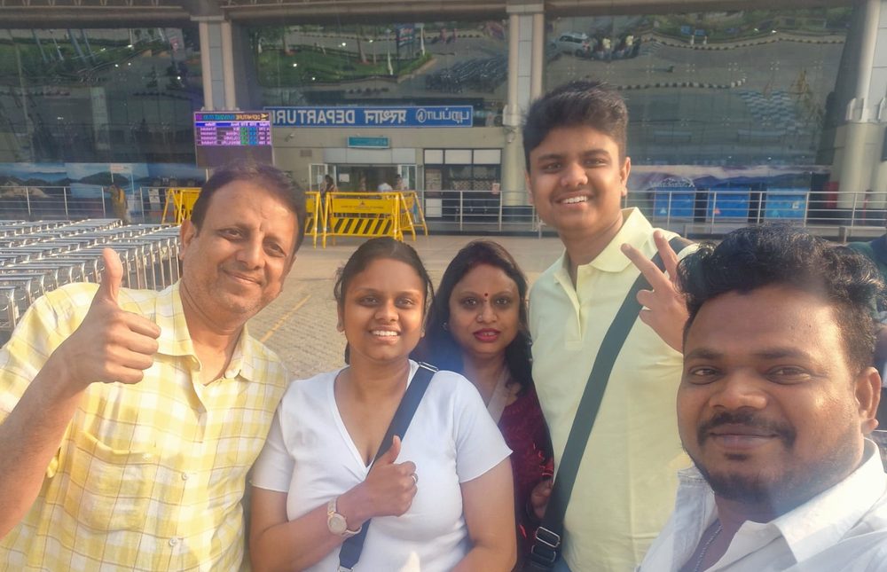 Happy family at airport departure with South Moon driver – South India Tour Packages from Madurai
