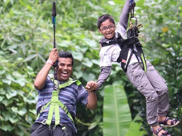 Father and son on a zipline adventure
