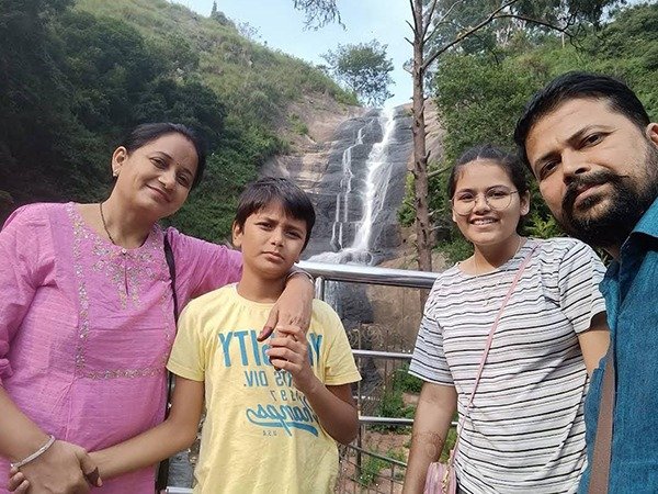 Family at Silver Cascade waterfalls, Kodaikanal – Madurai Tours and Travels