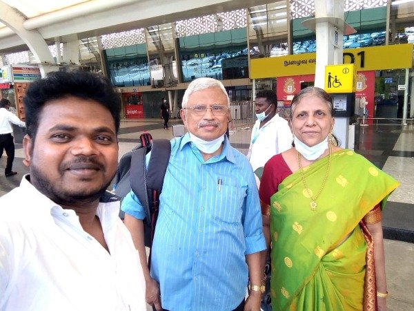 Couple with South Moon driver at Chennai airport – Best Travel Agency in Madurai